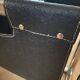 Chrome metal and leather magazine rack