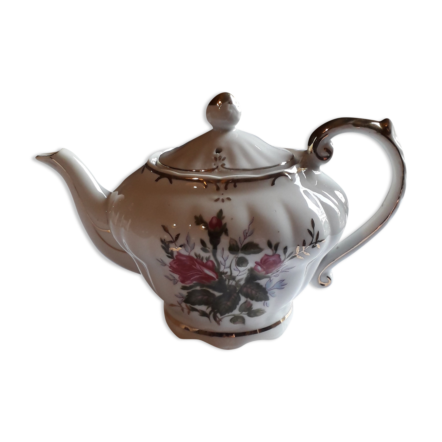 Musical teapot in white porcelain with floral decoration