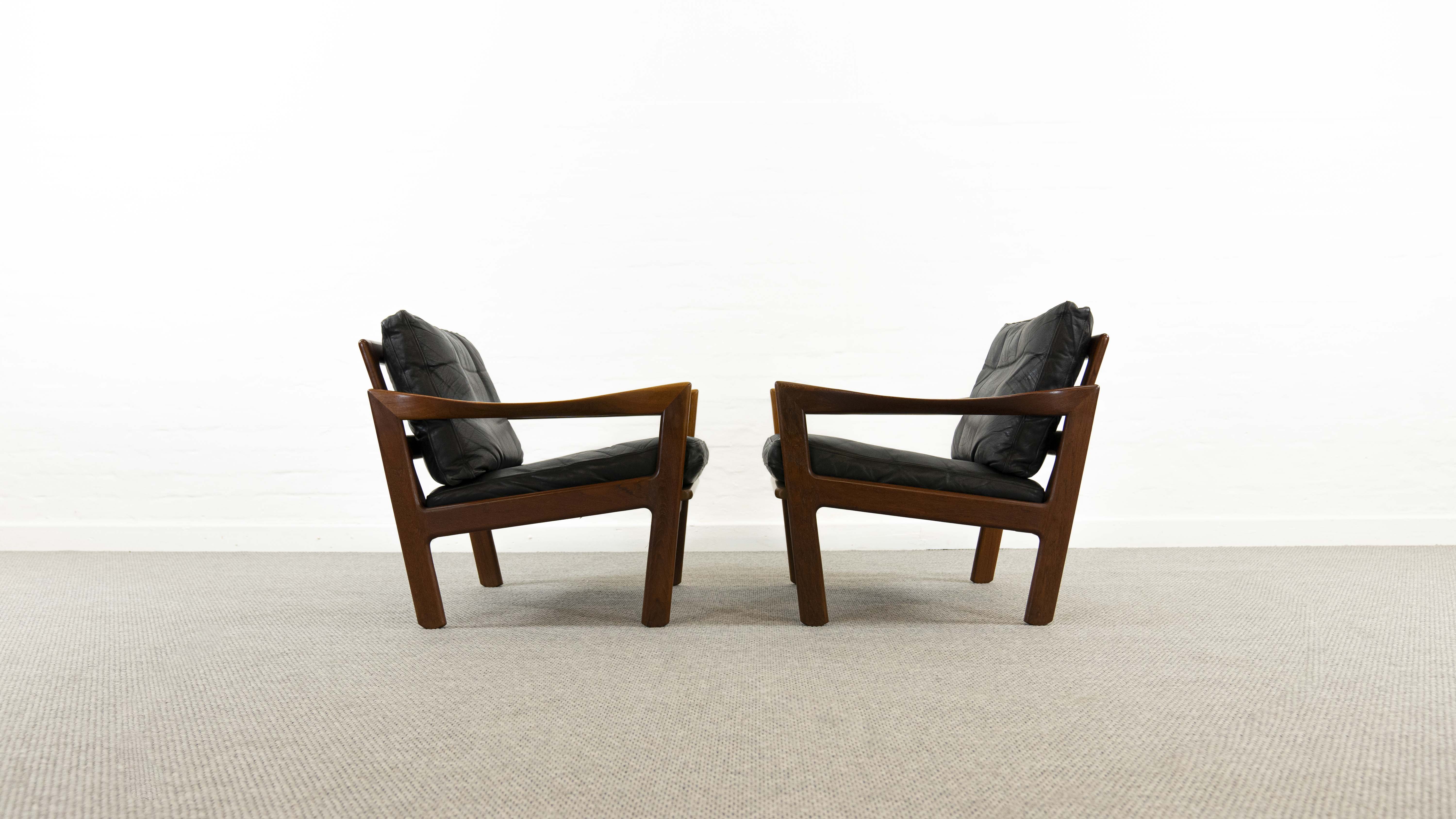 Pair of teak chairs in black leather by Illum Wikkelsoe for Niels Eilersen, Denmark