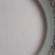 Flat earthenware plates with gilded edges