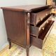 Empire style chest of drawers with gooseneck