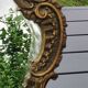 Victorian style table mirror. Decor Rinceaux, curved foot. In bronze patina old gold. 27 x 20 cm
