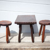 Set of coffee table and 2 carved wooden stools, brutalist
