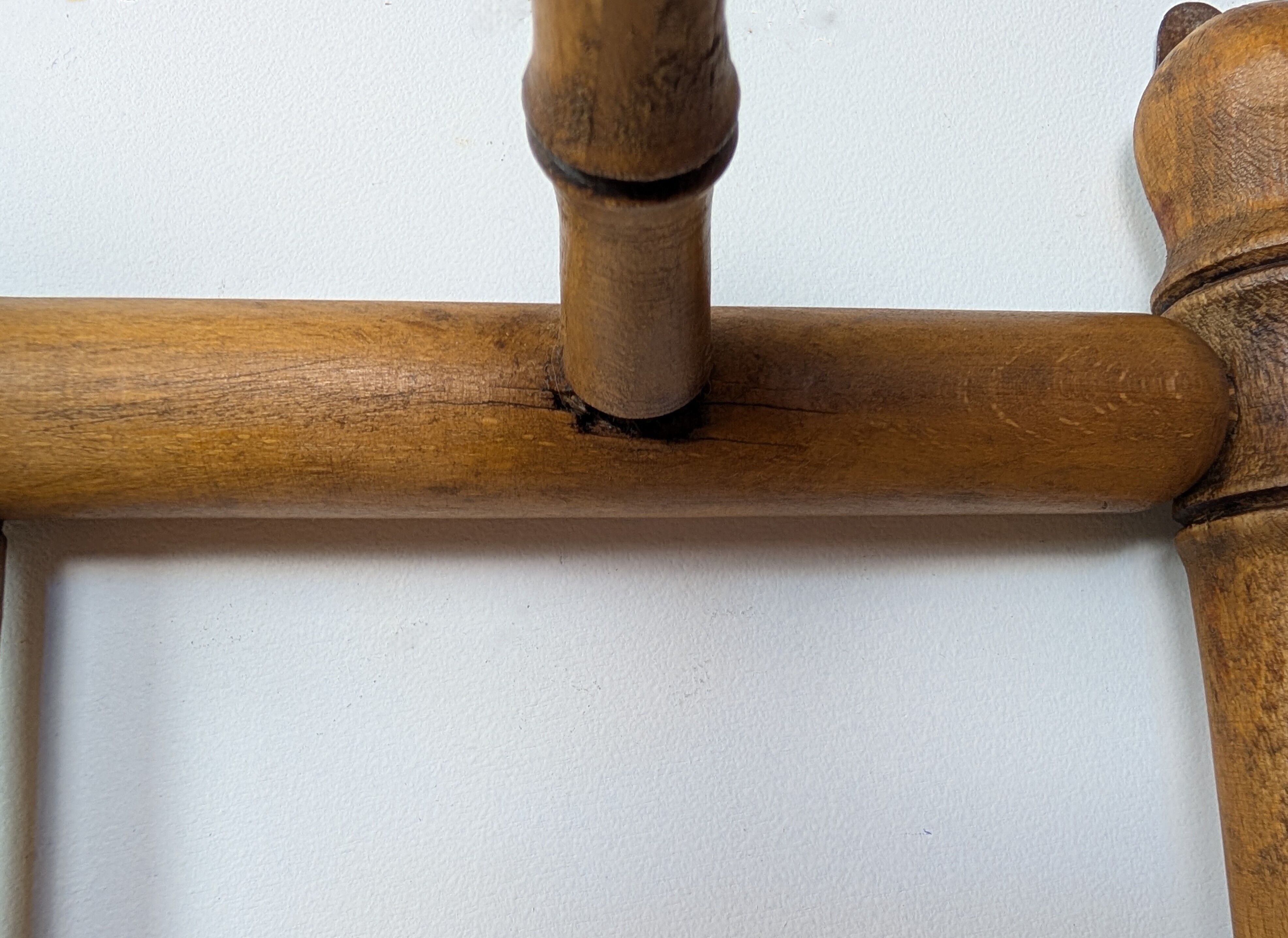 Wall-mounted coat rack made of turned wood