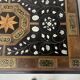 Blackened wood display table with marquetry top, Spain, 19th century.