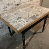 Solid wood table with newspaper pattern