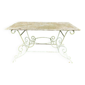 Old wrought iron garden furniture table