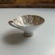 Solitaire tea cup, saucer, and dessert plate in white and gold.