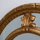 20th century neo-classical style tilted oval mirror by Deknudt, Belgium