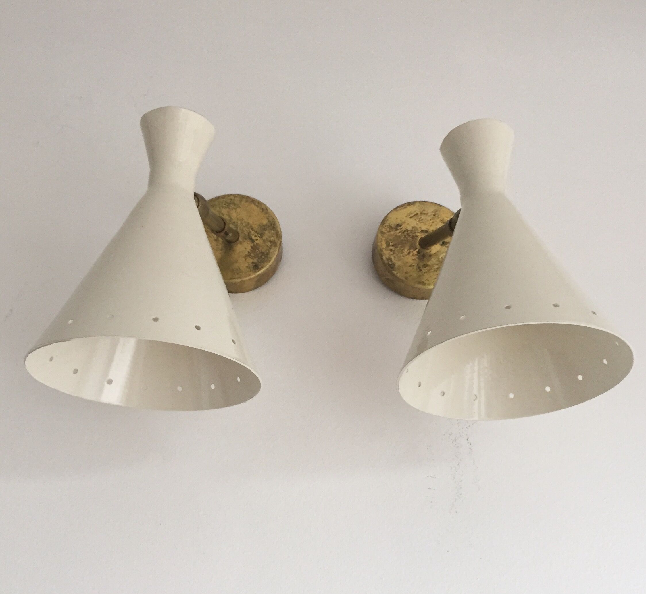 Pair of white and brass sconces