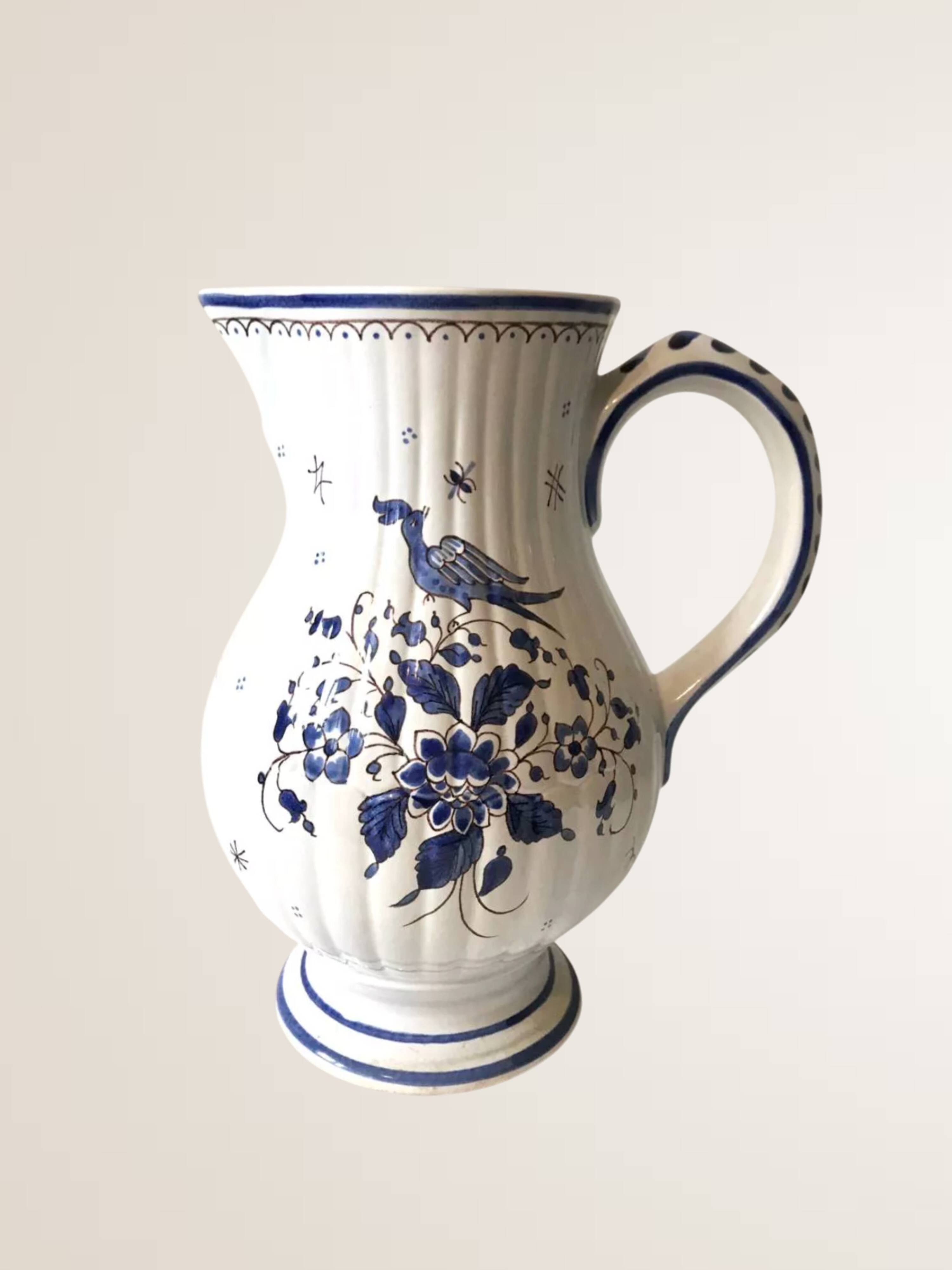 Moutiers earthenware jug, hand-painted blue decoration.