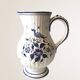 Moutiers earthenware jug, hand-painted blue decoration.