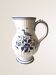 Moutiers earthenware jug, hand-painted blue decoration.