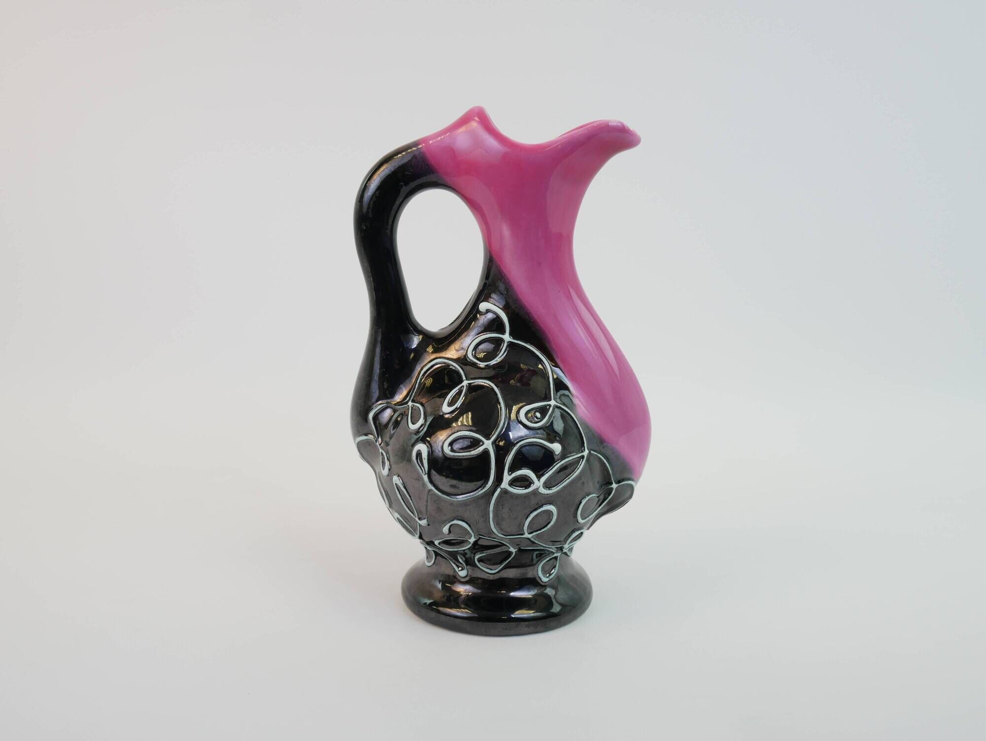 Black and pink Vallauris carafe with white relief patterns