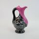 Black and pink Vallauris carafe with white relief patterns