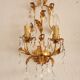 Hand-forged wall lamp gilded with gold leaf and crystals, Italy