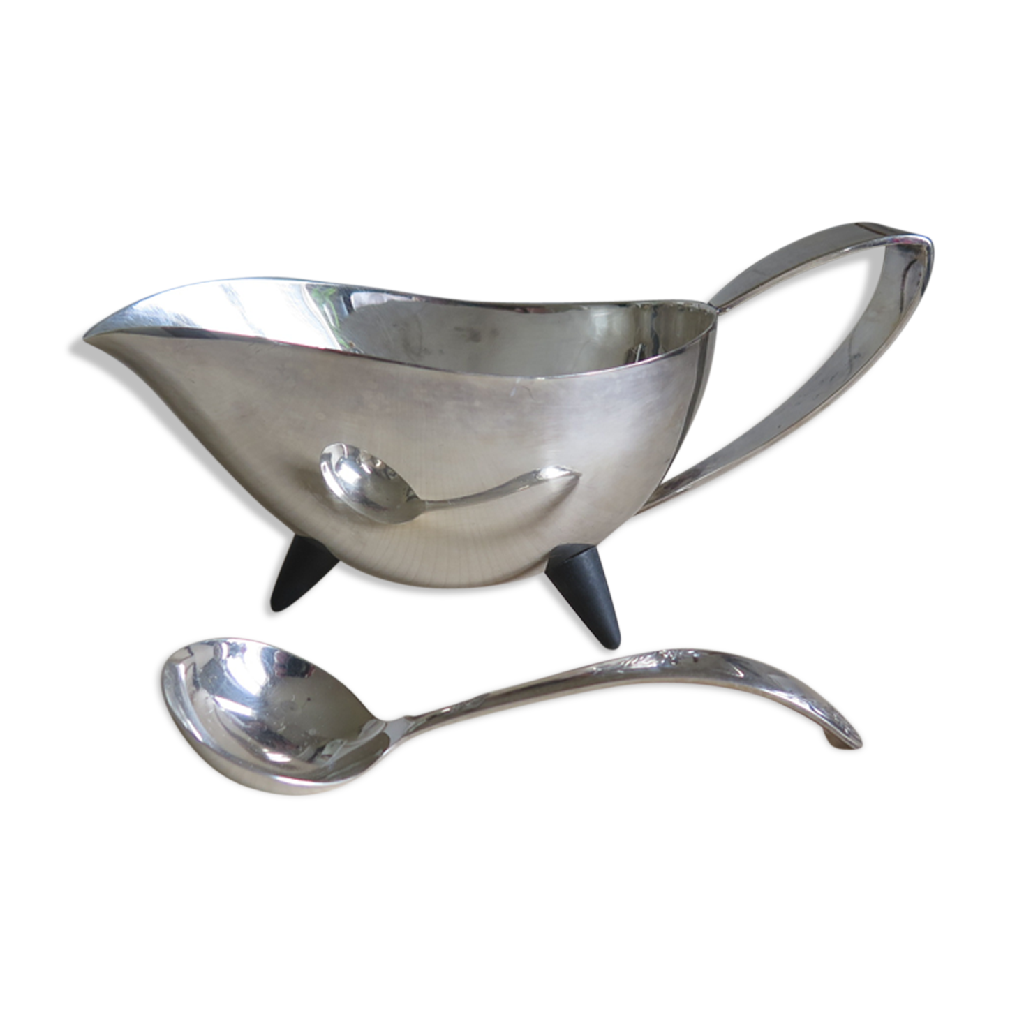 Angora tripod and silver metal spoon