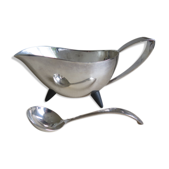 Angora tripod and silver metal spoon