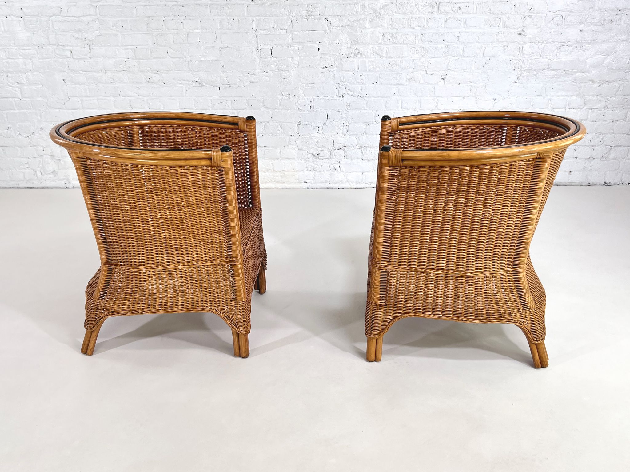 Pair of cabriolet armchairs in wicker and black edging