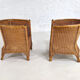 Pair of cabriolet armchairs in wicker and black edging