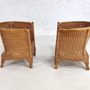 Pair of cabriolet armchairs in wicker and black edging