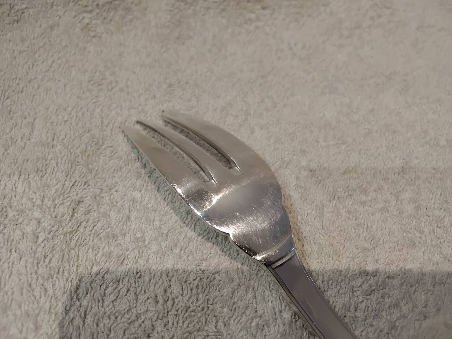 Silver-plated metal stew fork by Christofle silversmiths, Atlas model