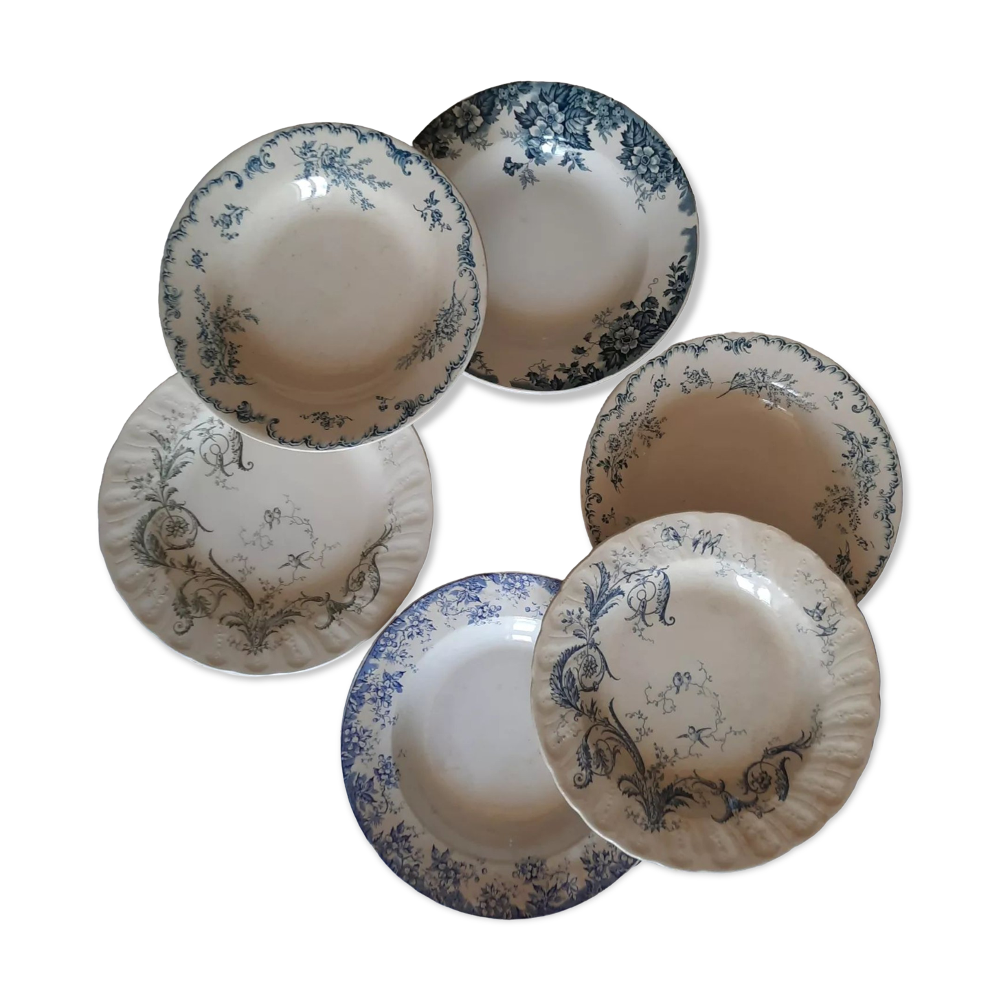 Old mismatched hollow plates in iron earth earthenware