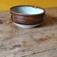 Old small glazed ceramic dish with lion head decoration - brown enamel kitchen bowl