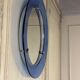 Mirror framed by a blue glass circle, italy circa 1950