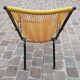 Folding chair in red scoubidou and black metal structure