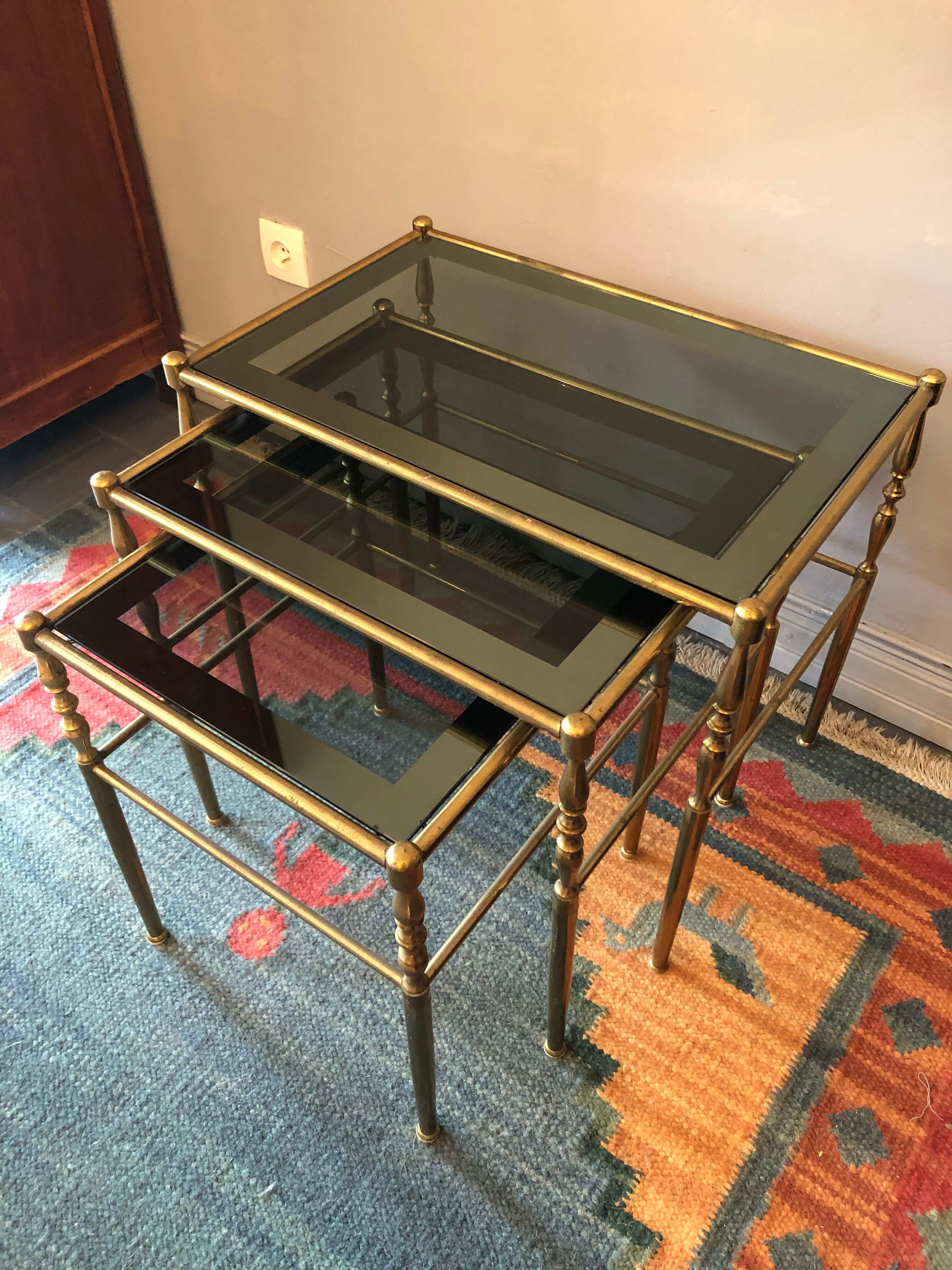 Brass tables and smoked glasses