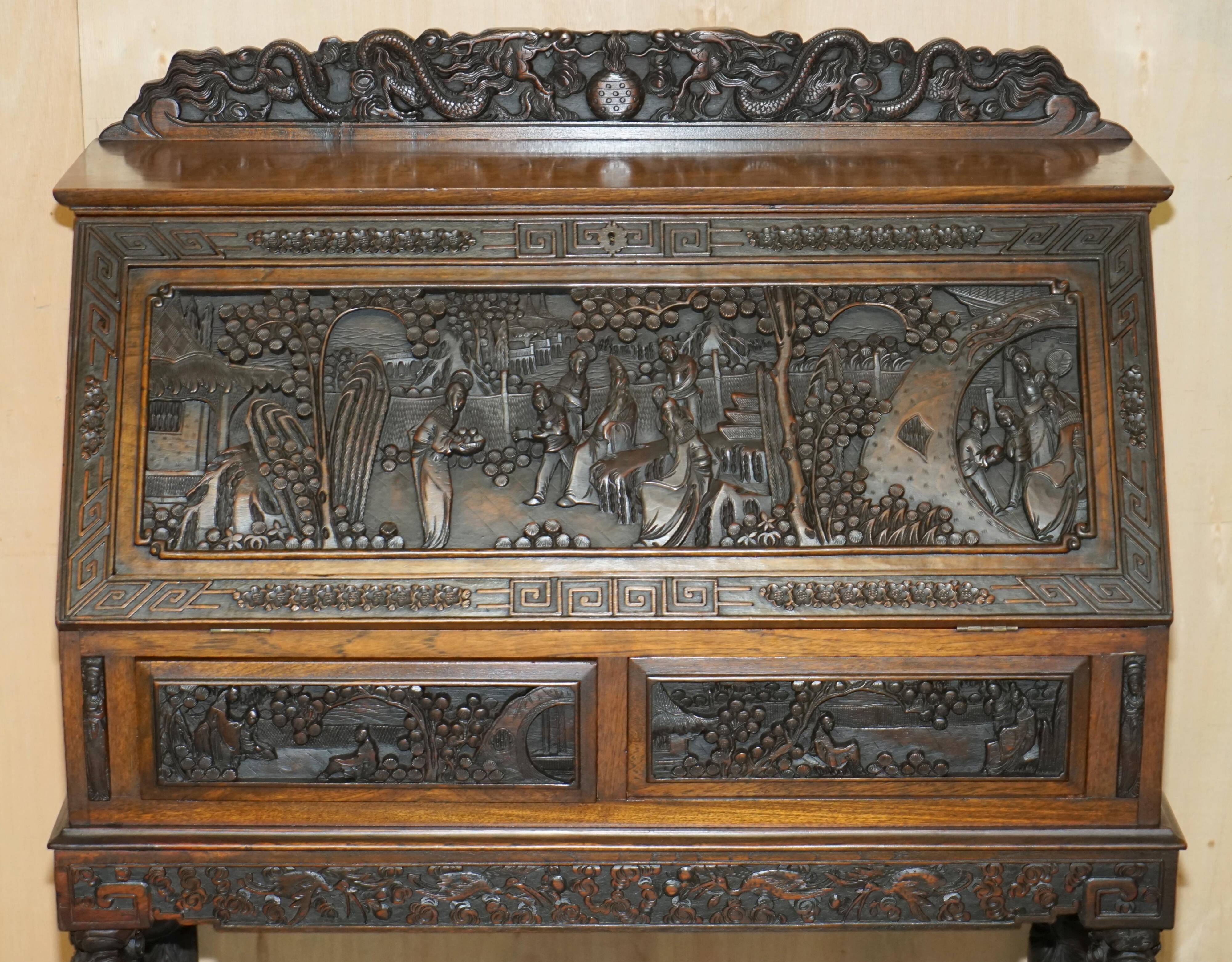 Chinese hand-carved desk from around 1940 with matching chair.