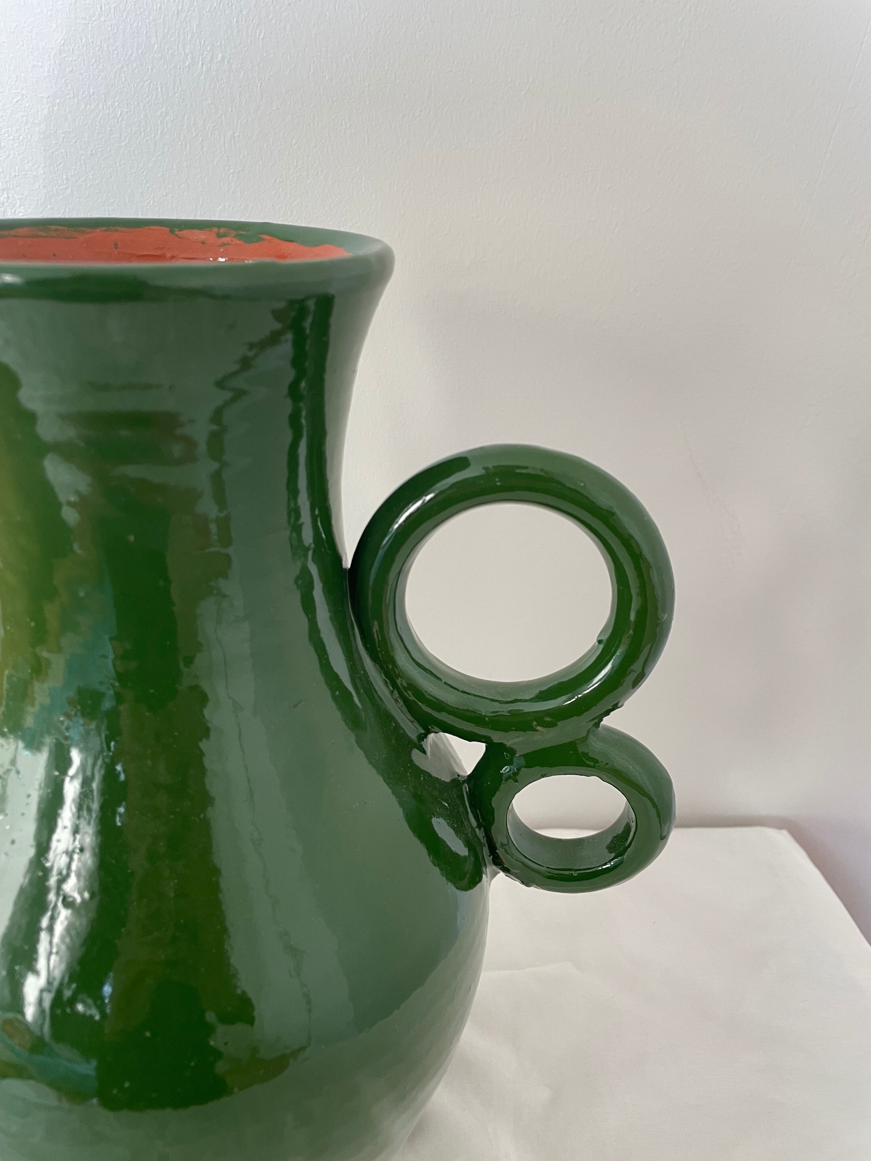 Green ceramic amphora vase with large handmade circular handles