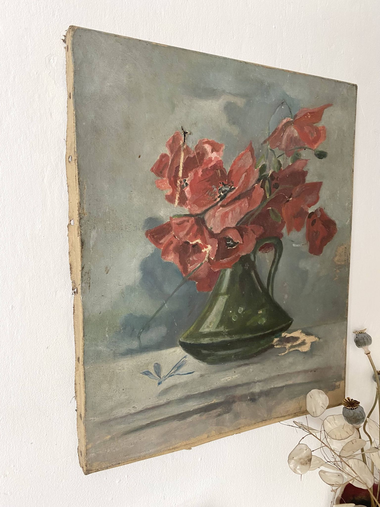 Old painting of a bouquet of poppies, canvas on a flower frame