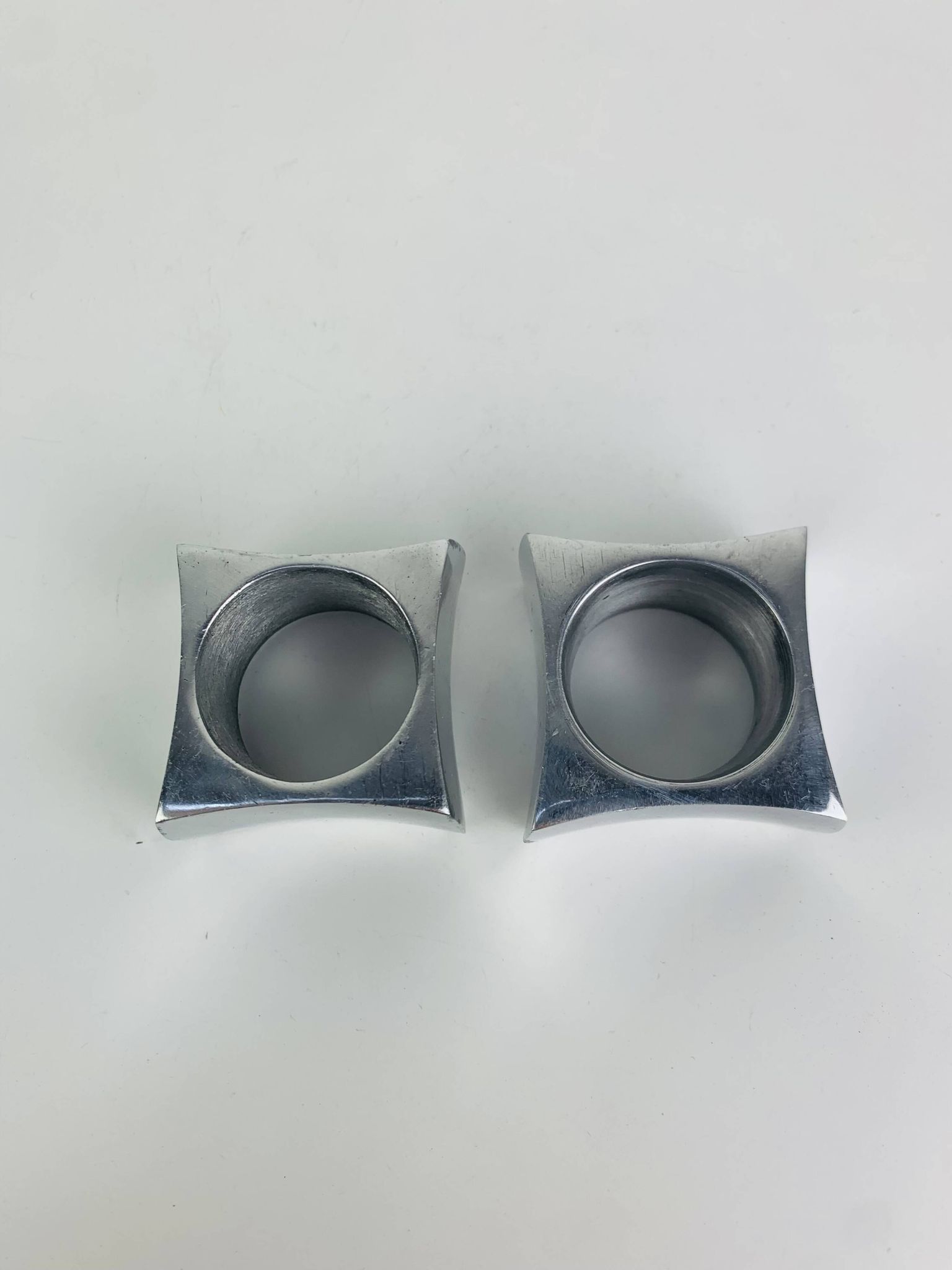 Pair of egg cups or space age napkin rings in aluminium, 1970s.
