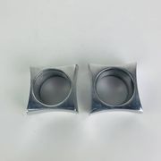Pair of egg cups or space age napkin rings in aluminium, 1970s.