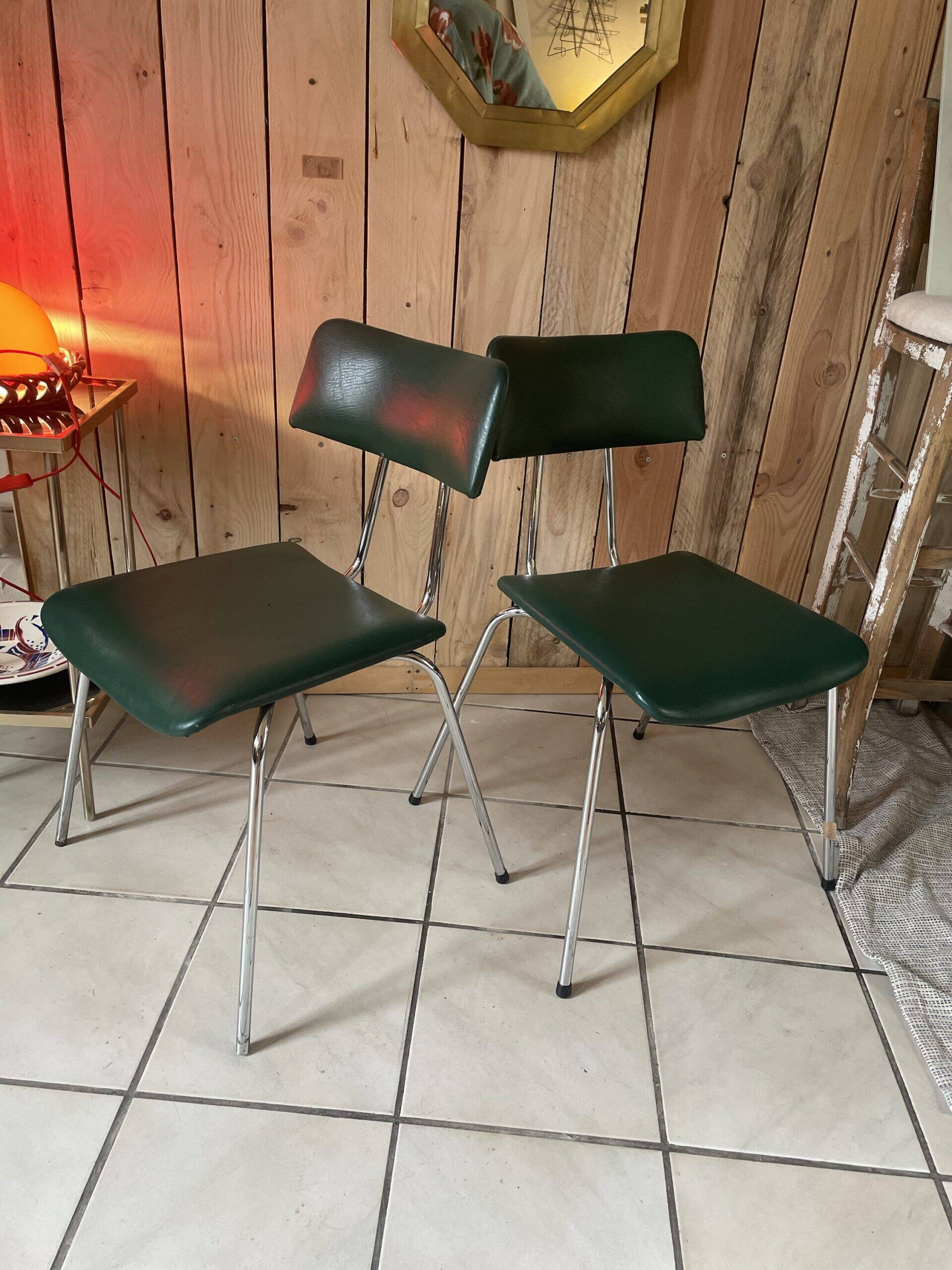 Pair of green faux leather chairs