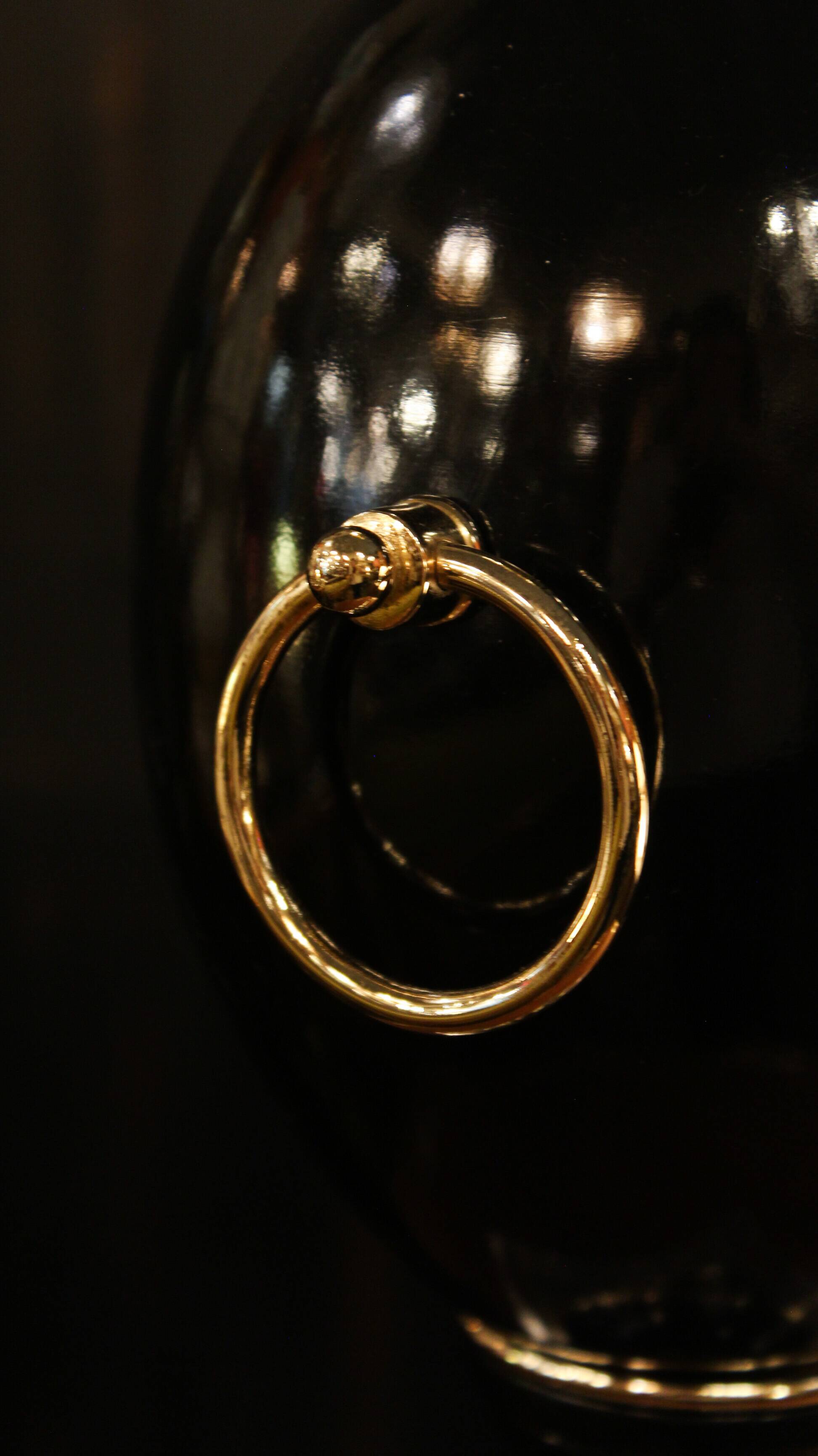 Black lamp in Hollywood Regency style