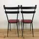 Pair of 1950s chairs in metal and red faux leather, Gueden-Adnet style.