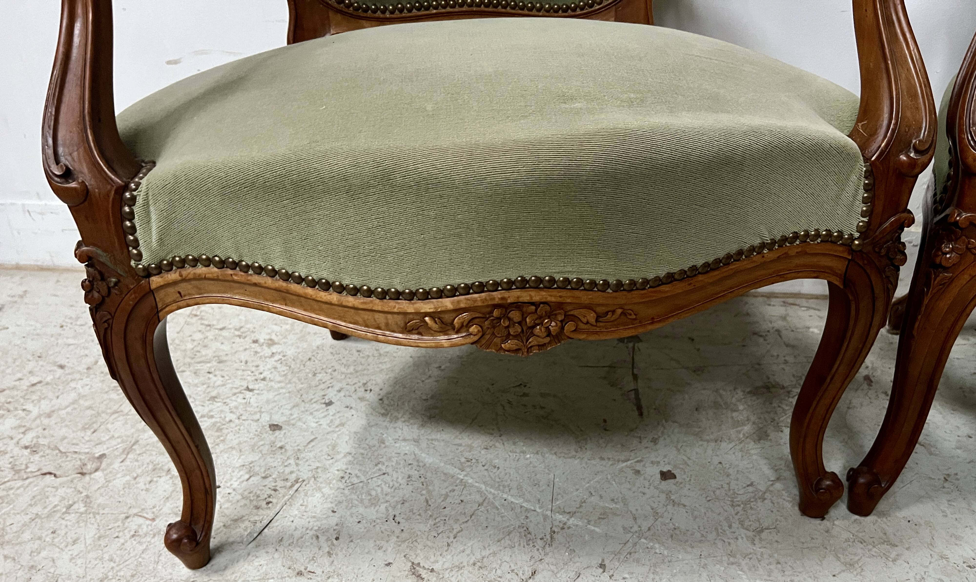 Pair of Louis XV style armchairs in solid walnut, 20th century.