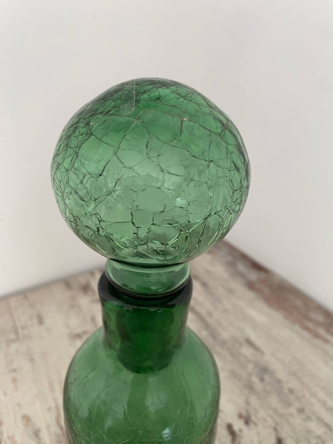 Old cracked glass carafe