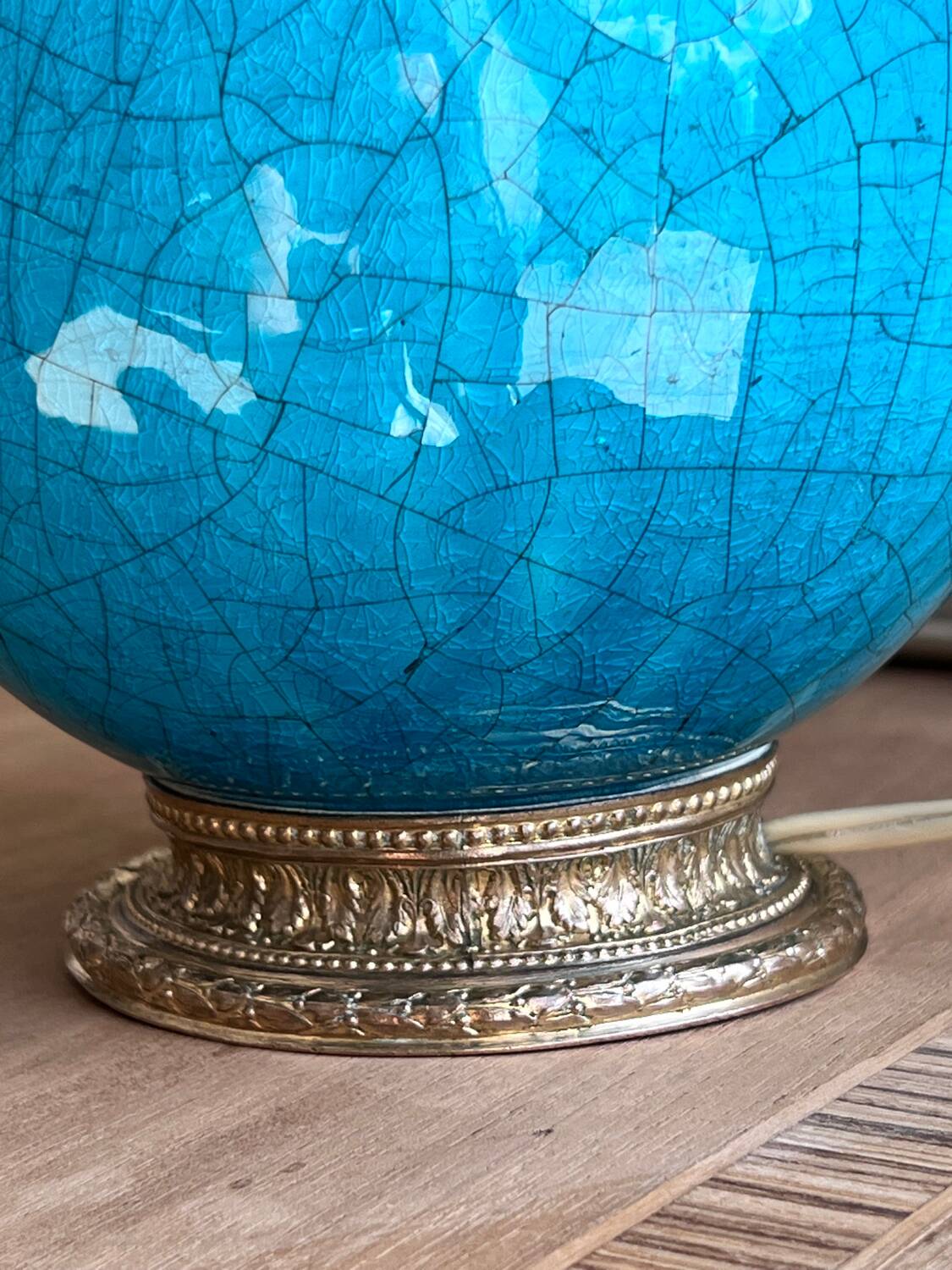Elegant turquoise crackled ceramic ball lamp, on a br base