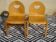 Light wood chairs, with a formed seat and backrest, both.