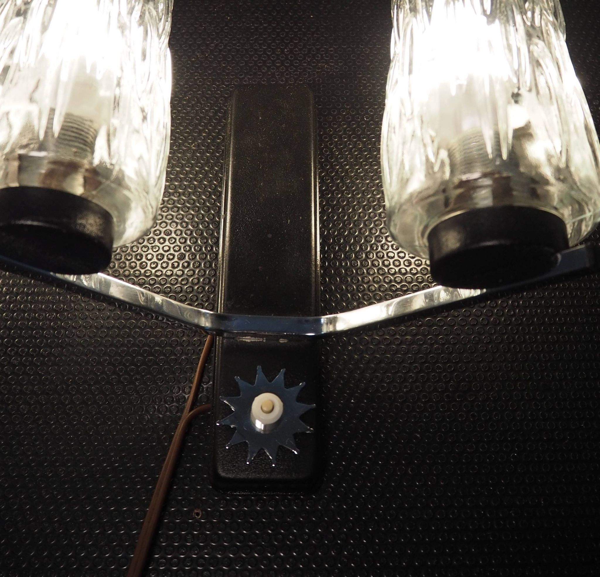 Pair of wall lights from the 1950s-1960s with a push button switch.