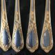 Christmas Pop-up 2022 Set of 4 gold-plated dessert forks.