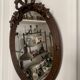 Miroir ovale ancien en bois sculpté et noeud de style Louis XVI