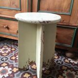 A rough wooden stool patinated by time