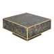 Square coffee table in marbled glass with "solar eruption" decor.