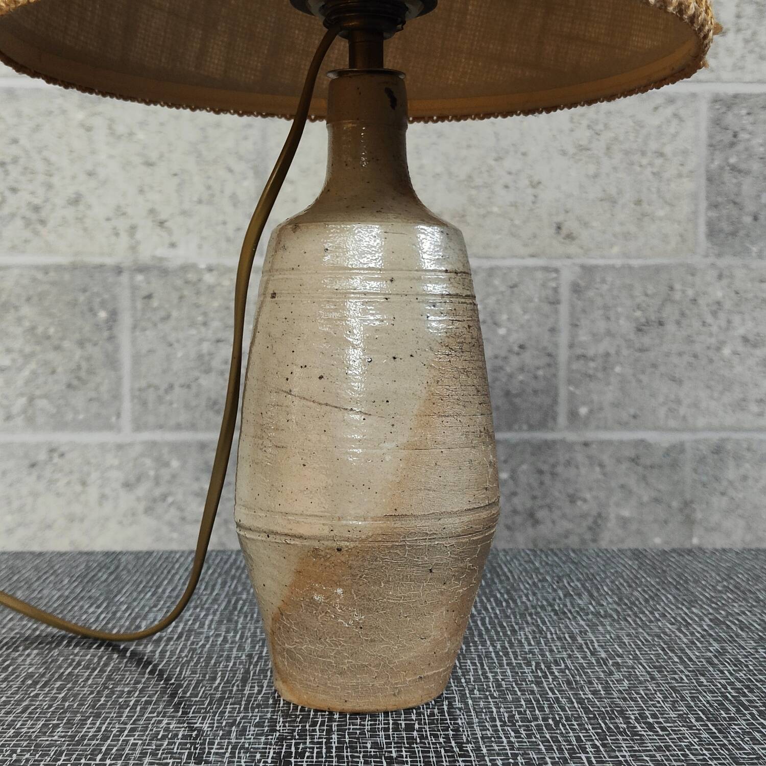Patinated sandstone and jute ceramic lamp