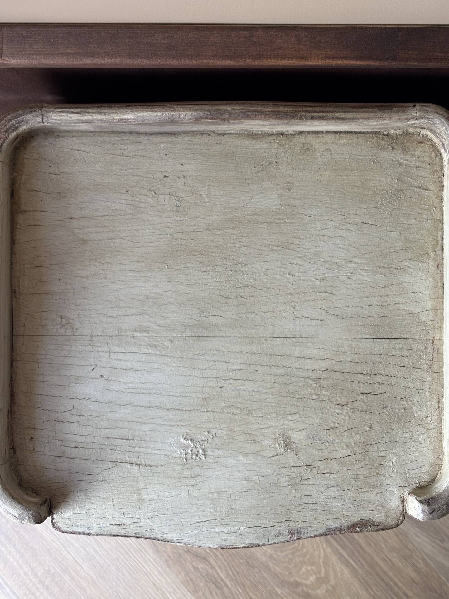 A pair of distressed bedside tables.